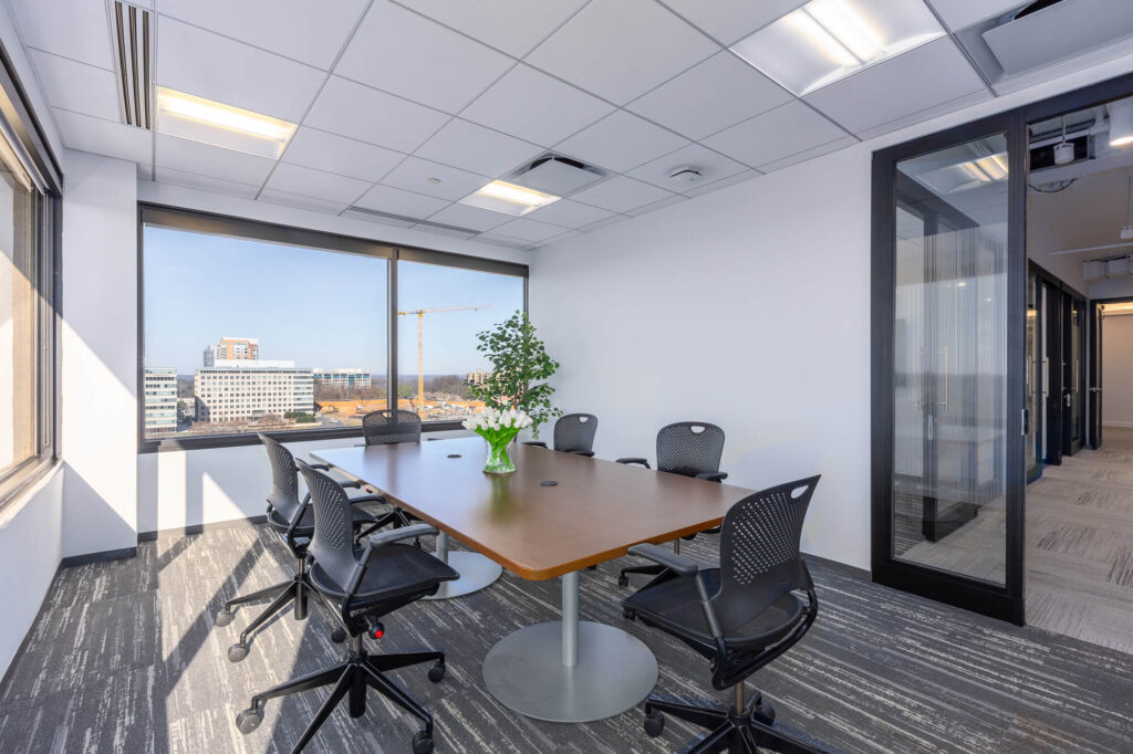 Meeting room with a large table and chairs.