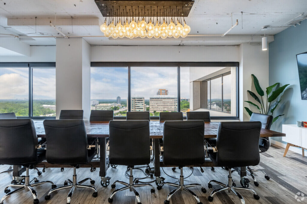 A conference room with a large table for meeting rooms.