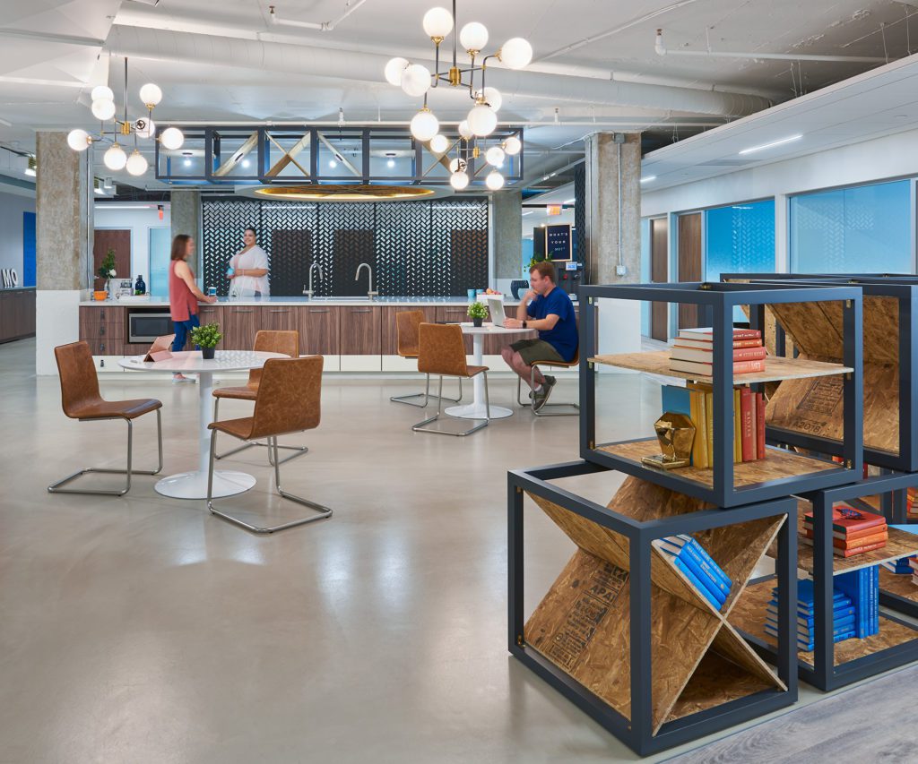 A private office with plenty of bookshelves and tables.